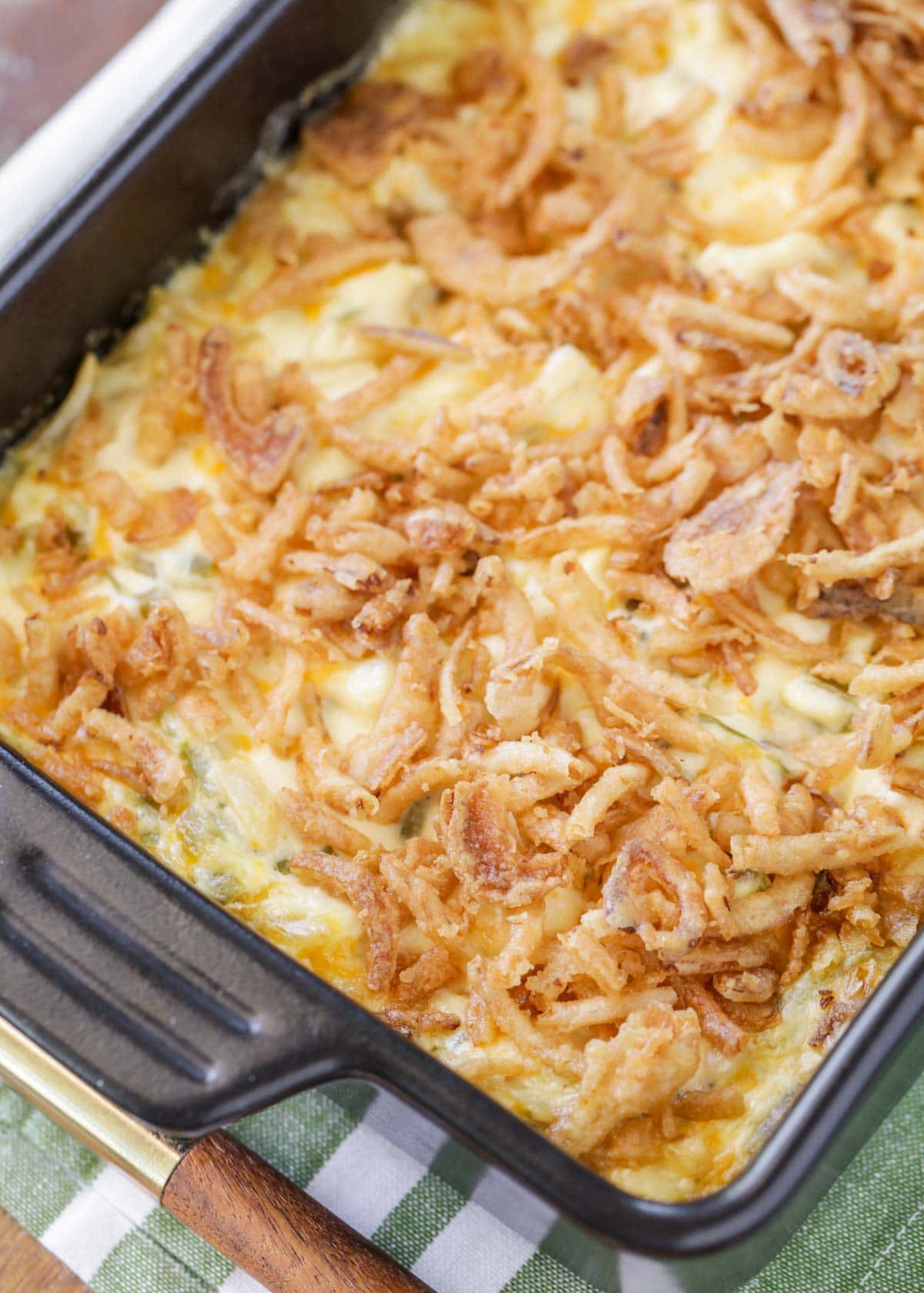 French onion chicken casserole topped with onions in a baking dish