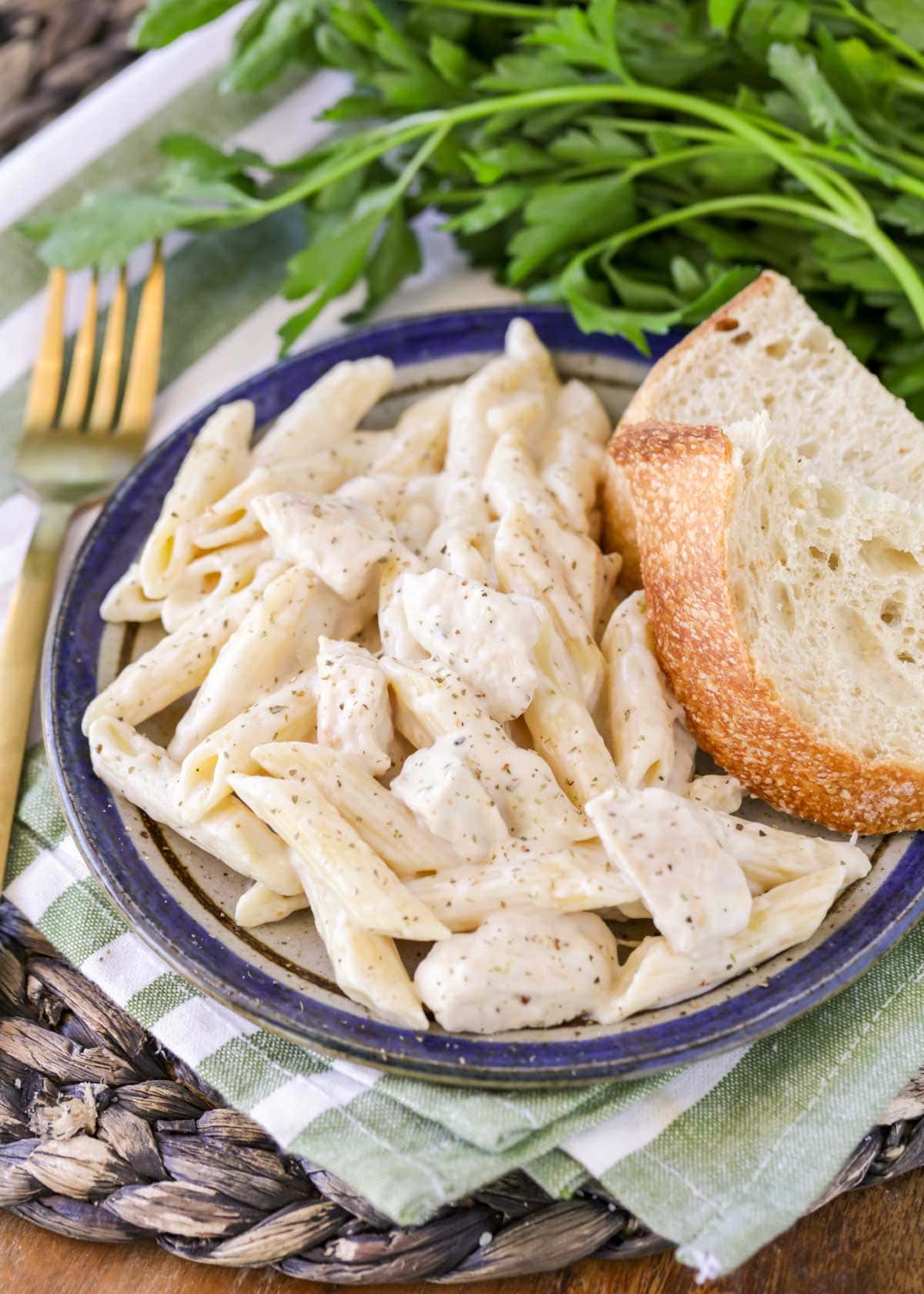 Chicken Penne Pasta recipe with slice of bread on plate