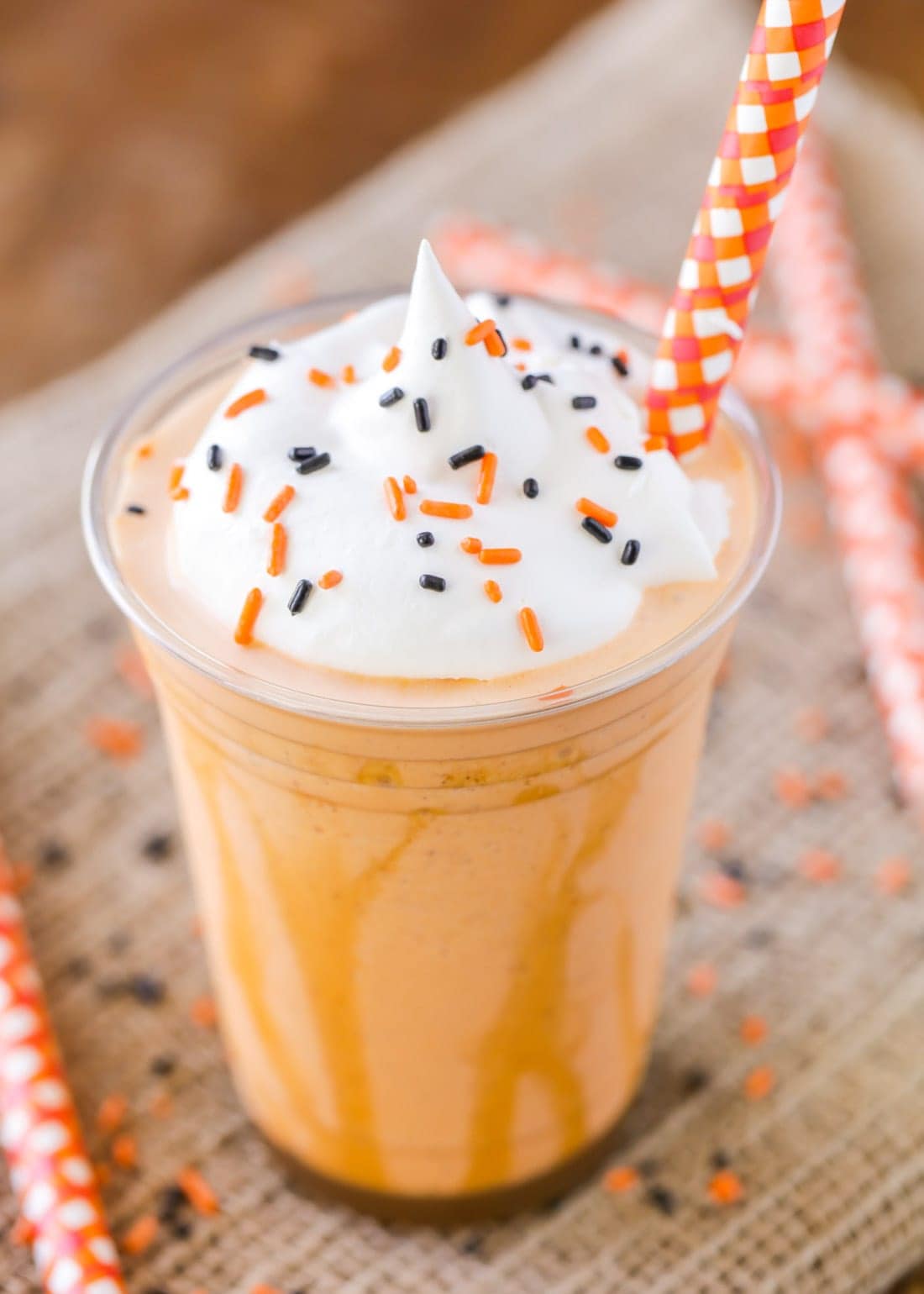 Pumpkin Milkshake recipe in cup with whipped cream and sprinkles